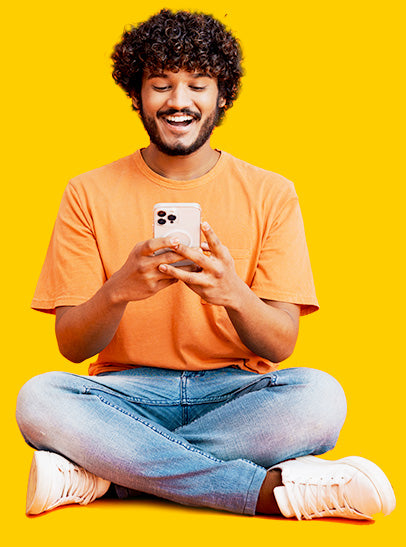 Man sat on the floor on his phone